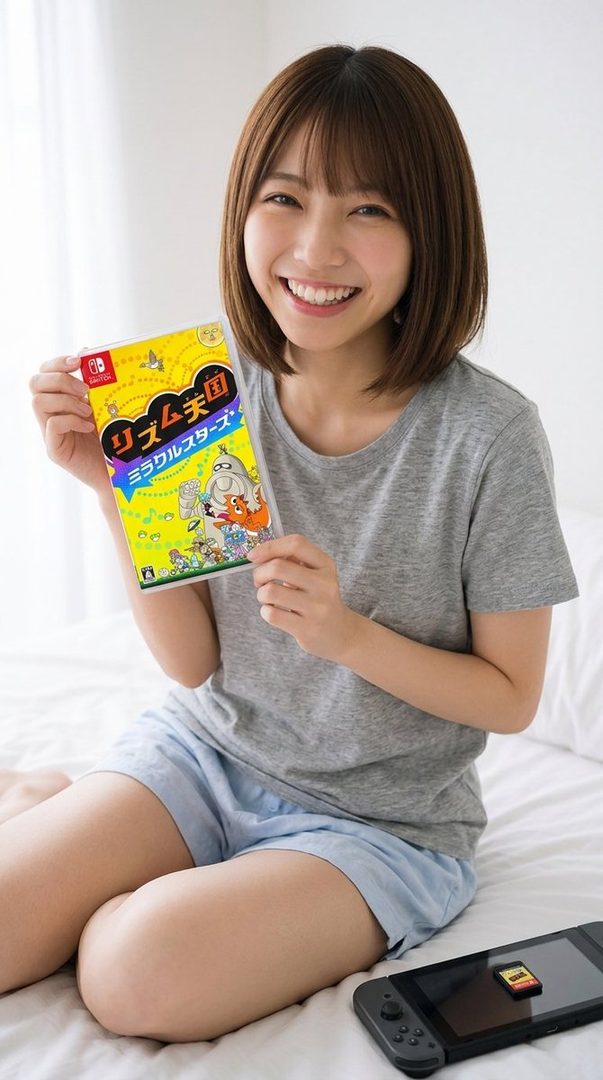 A young woman with short brown hair and bangs, wearing a grey t-shirt and blue shorts, smiles brightly while holding a Nintendo Switch game case. A Nintendo Switch console and game cartridge are on the bed beside her.