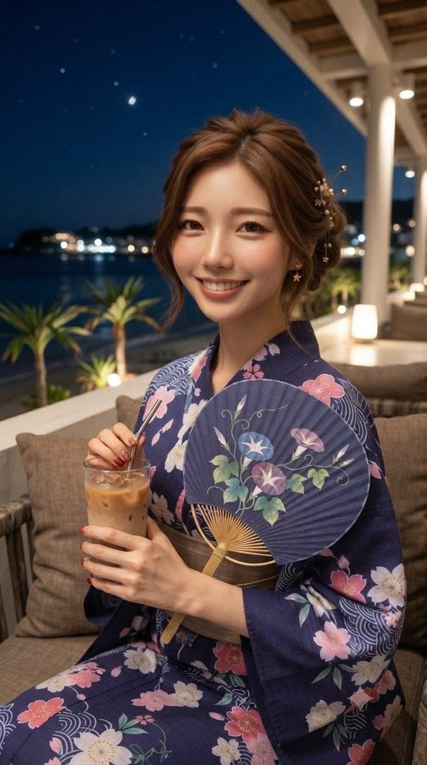 A young East Asian woman in a traditional blue yukata with floral patterns, holding a drink and a fan, smiling at the camera at night with a beach and palm trees in the background.