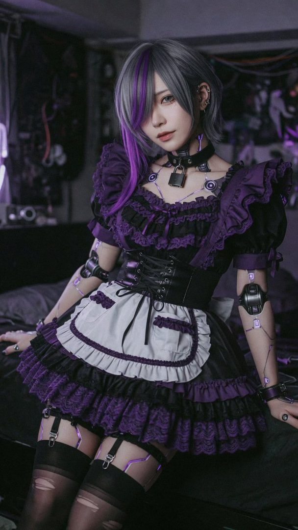 A young woman with short, grey and purple hair, wearing a gothic maid outfit with a corset and thigh-high stockings, posing indoors.
