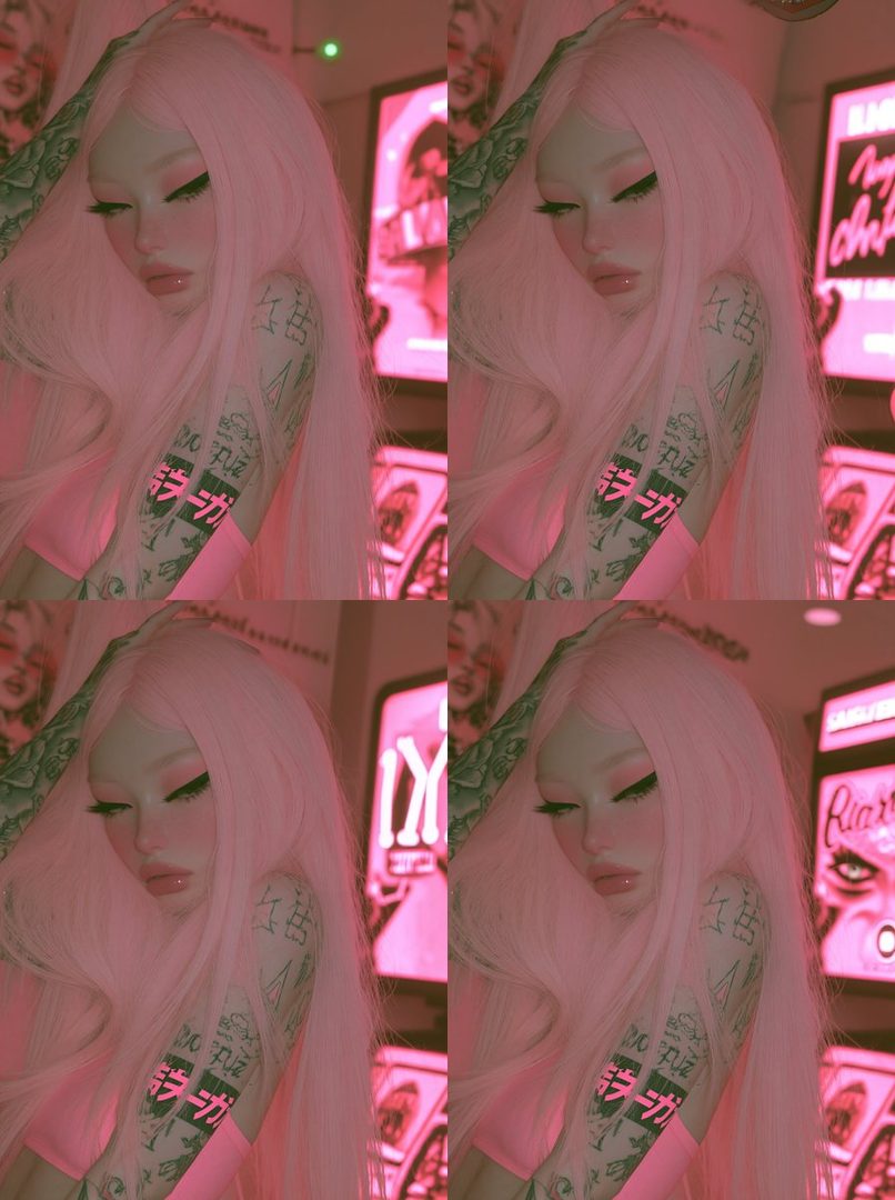 A young woman with long pink hair and tattoos on her arm, posing indoors with a soft, dreamy aesthetic.