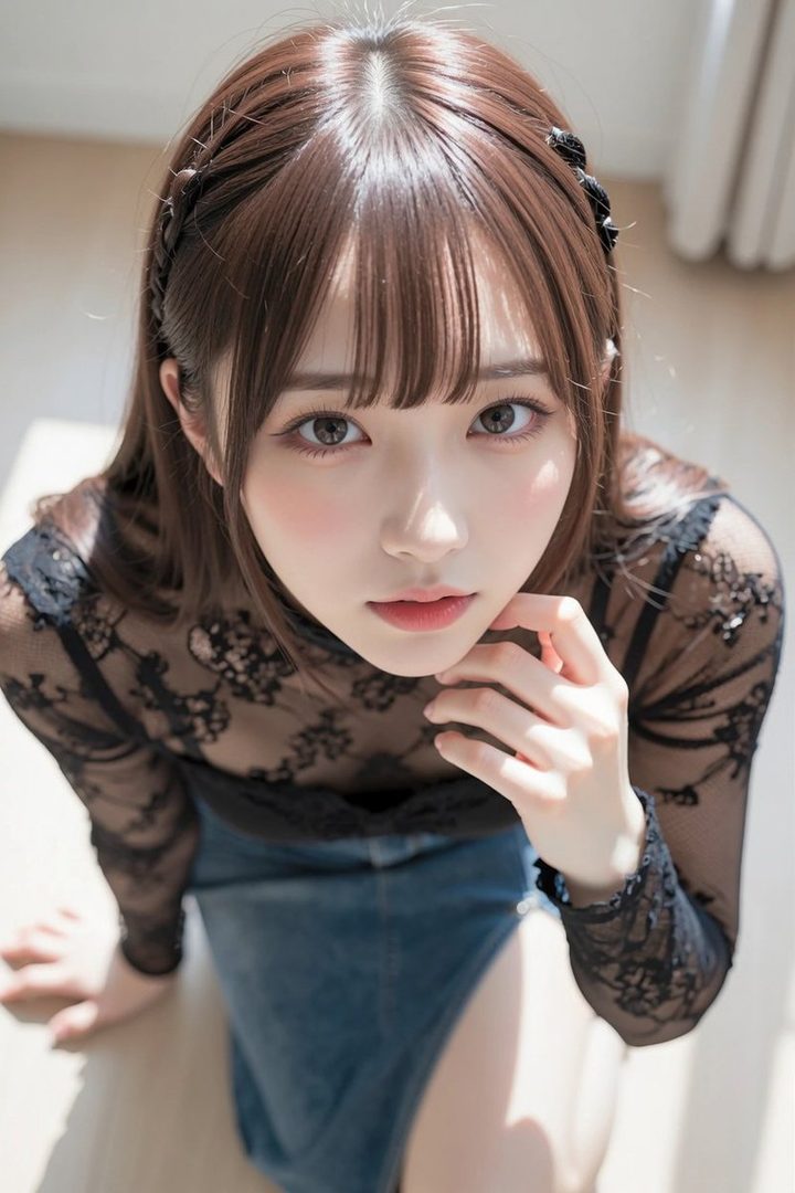 A beautiful young woman with long brown hair and bangs, wearing a black lace blouse and a denim skirt, looking up at the camera with a gentle expression.