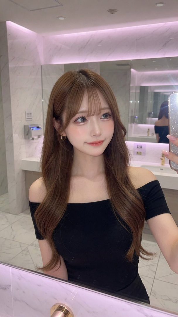 A beautiful AI-generated woman with long brown wavy hair and bangs takes a selfie in a bathroom, wearing a black off-shoulder top and hoop earrings.