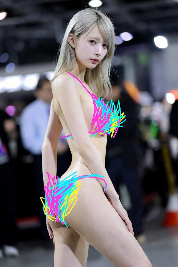 A silver-haired woman in a neon-scribbled bikini posing indoors at an event space.