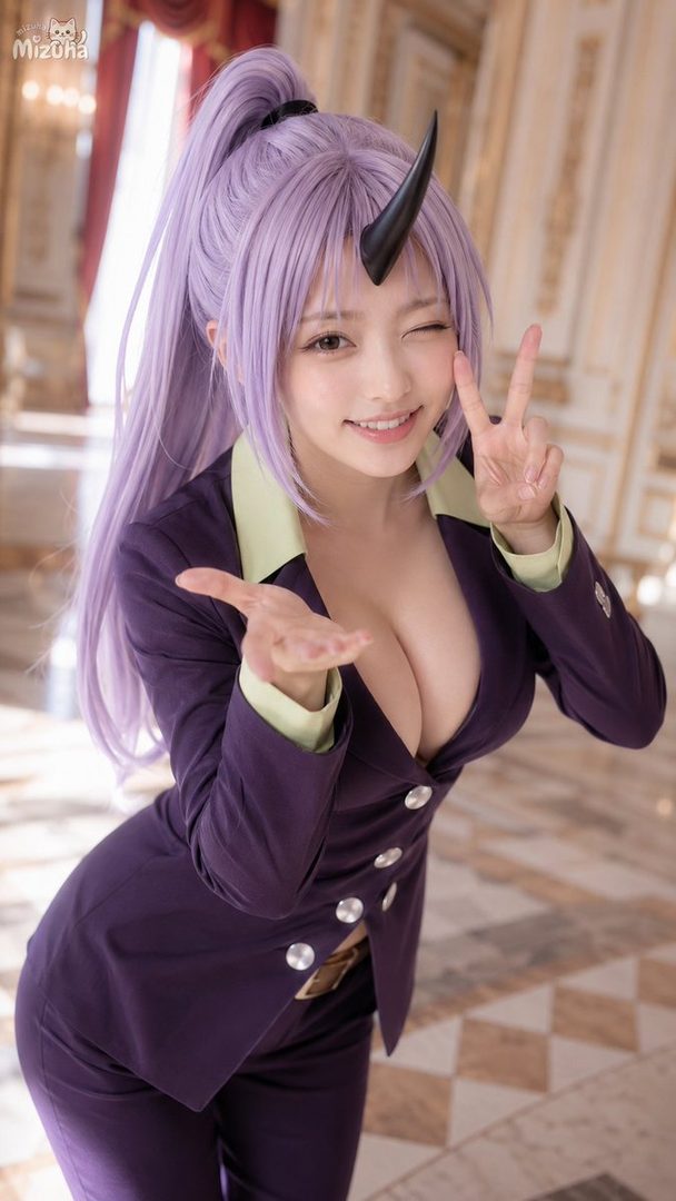 A playful woman with long purple hair and a horn cosplays as Shion from That Time I Got Reincarnated as a Slime, winking and making a peace sign.
