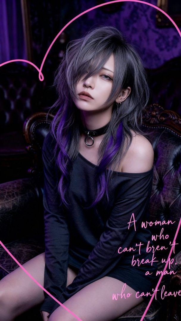 A person with silver and purple hair, wearing a black off-shoulder top and choker, sits on a dark leather chair in a dimly lit room.