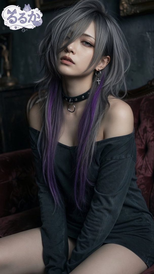 A woman with long silver and purple hair, wearing a black off-the-shoulder top and a choker, sits indoors.