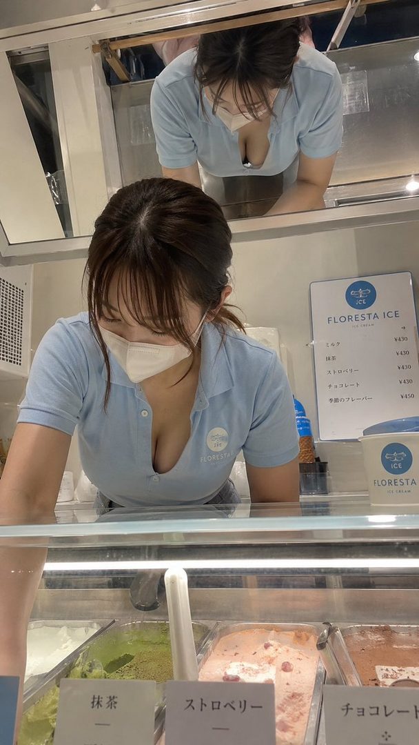 A woman in a light blue polo shirt and face mask leans over an ice cream counter, with a menu for Floresta Ice visible.