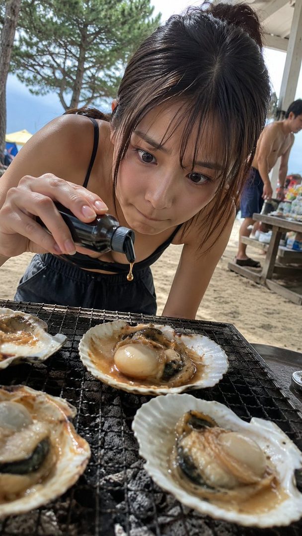 A young woman with brown hair is seen from a low angle, adding sauce to scallops on a grill at the beach.