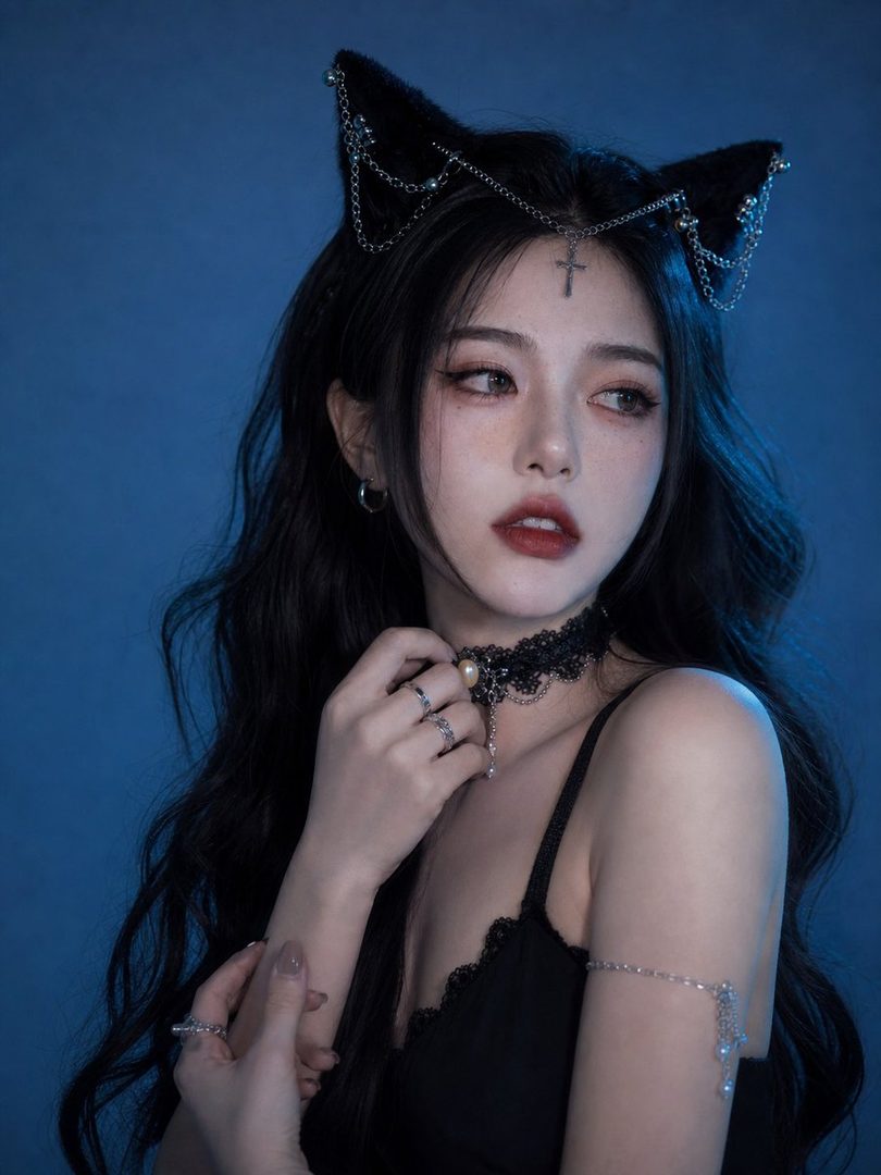 A photorealistic portrait of a woman with long black hair, wearing a black top and cat ear headband with chains, against a blue background.