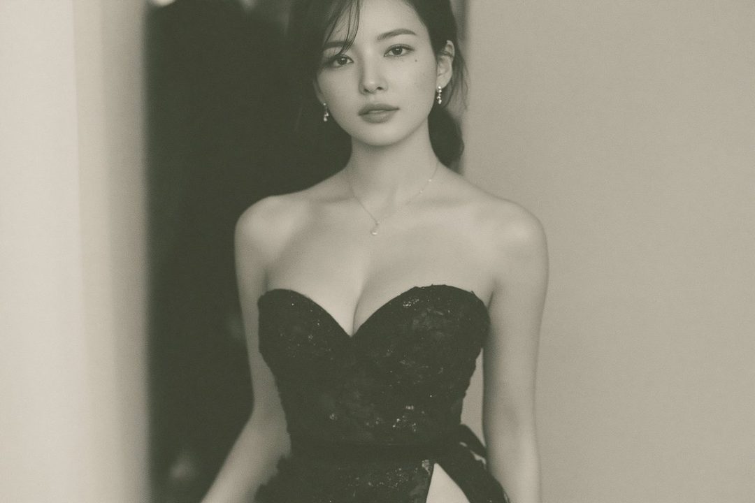A photorealistic portrait of an East Asian woman in a black strapless dress with a high slit.