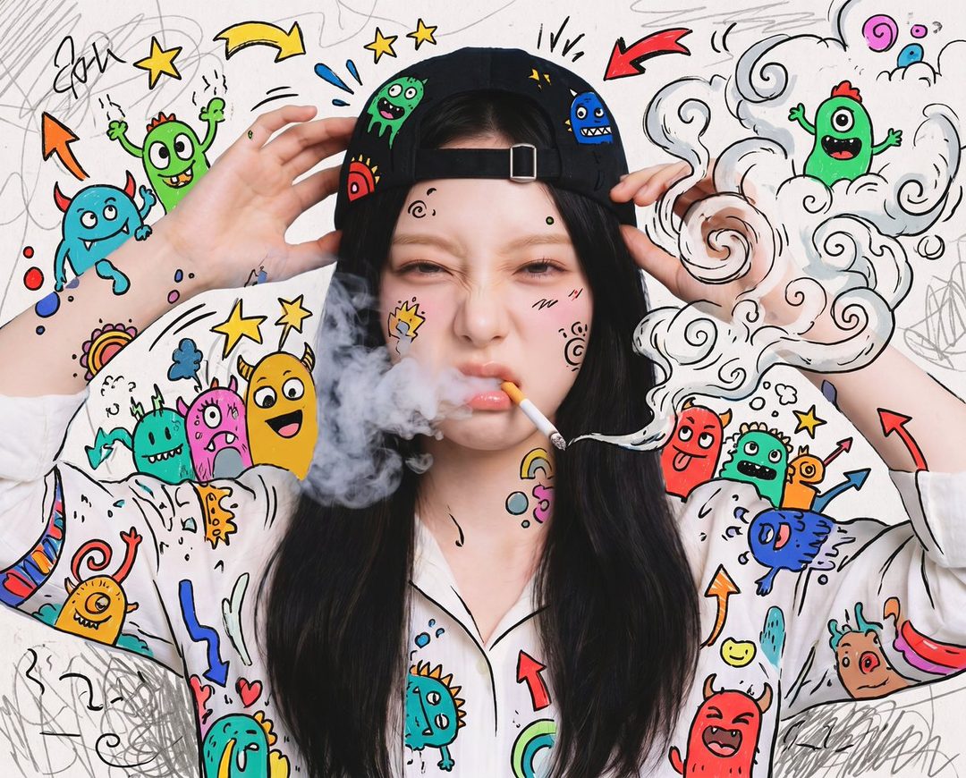 A playful portrait of a young woman with long black hair, wearing a black cap and a white shirt with colorful monster doodles, exhaling smoke from a cigarette.