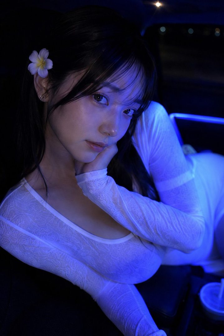 A photorealistic portrait of a young woman with black hair and a white top, illuminated by blue light in a car at night.