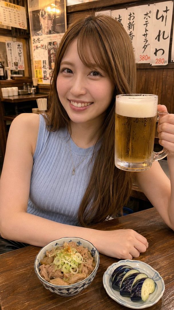 A smiling young woman with long brown hair holds a mug of beer and sits at a table with food in a Japanese izakaya.