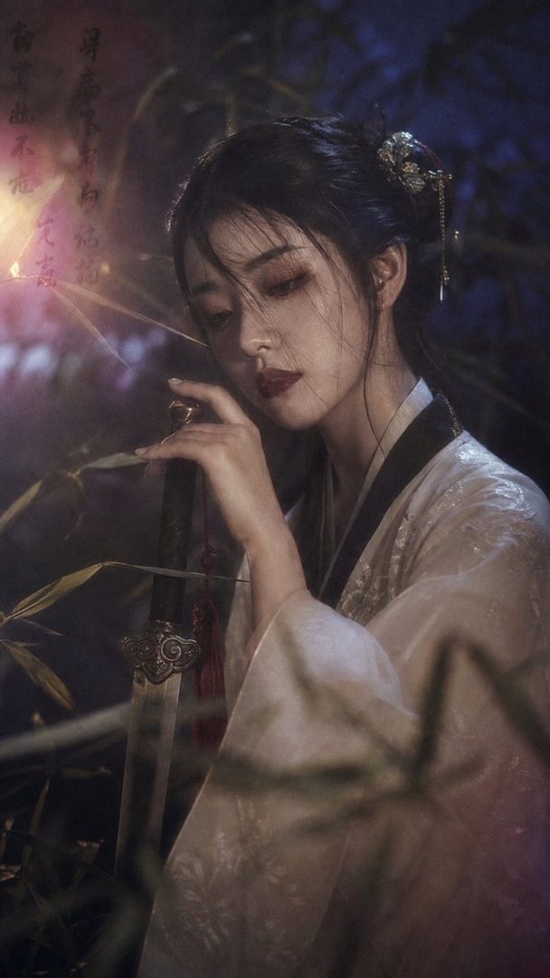 A beautiful East Asian woman in traditional Chinese attire holds a sword, with a dreamy, cinematic night scene.