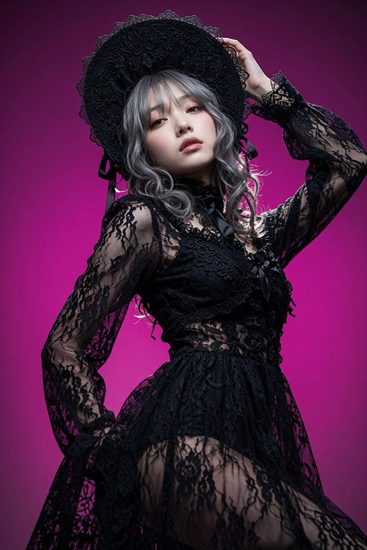 A young woman with silver hair and bangs, wearing a black lace gothic dress and hat, poses against a vibrant pink background.